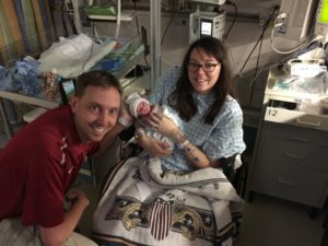 Ways to support a NICU mom - Mom and Dad visiting the NICU