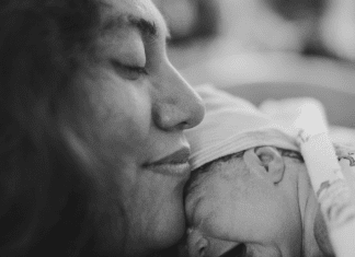 postpartum mom with newborn