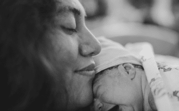 postpartum mom with newborn